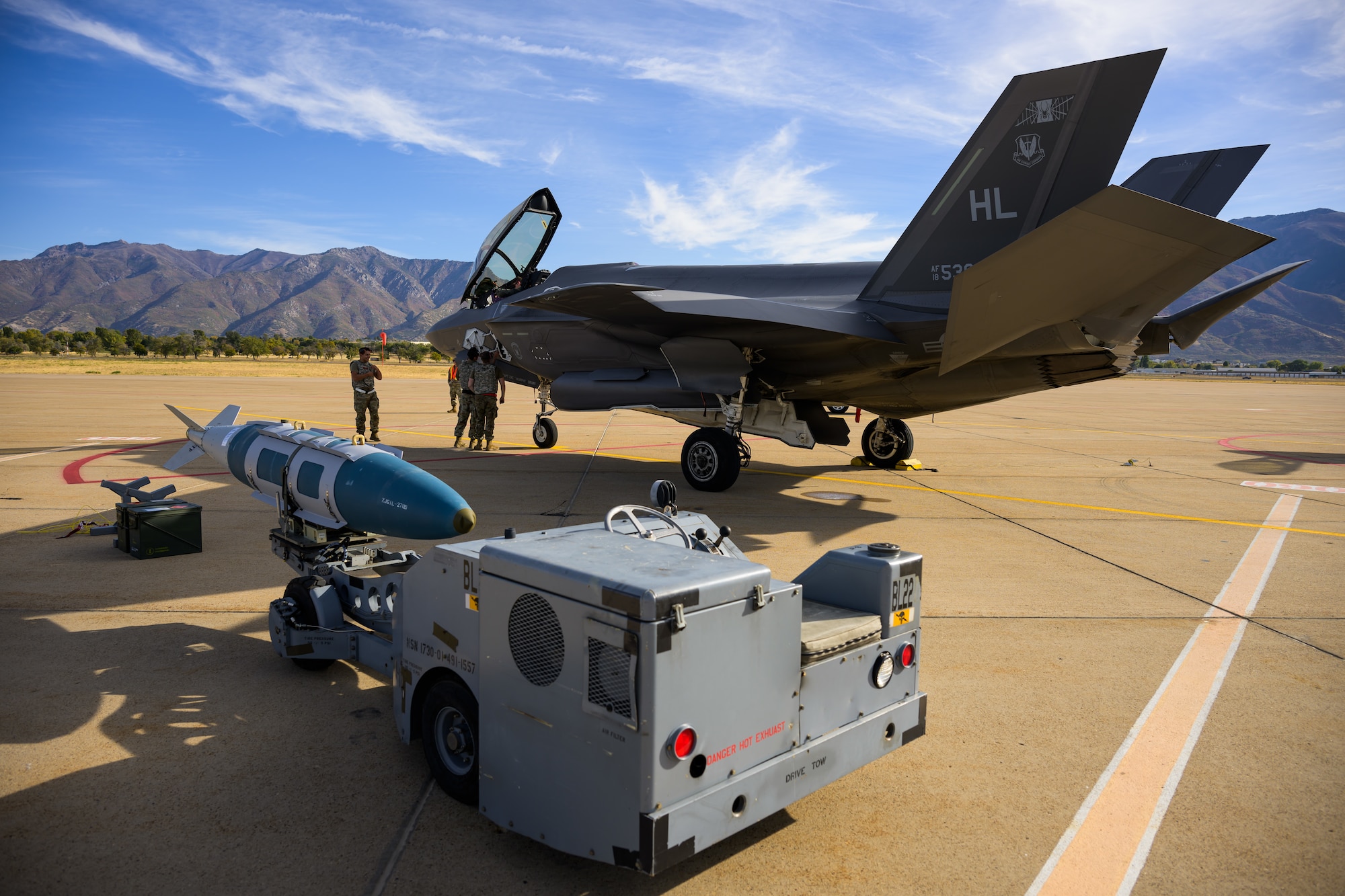 A photo of maintenance Airmen loading and fueling and preparing an F-35A Lightning II for launch.