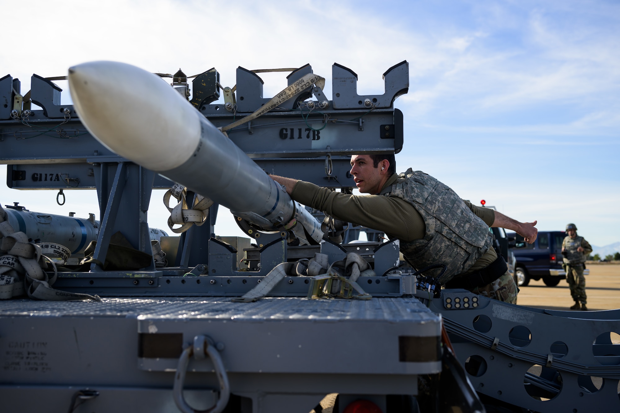 A photo of maintenance Airmen loading and fueling and preparing an F-35A Lightning II for launch.