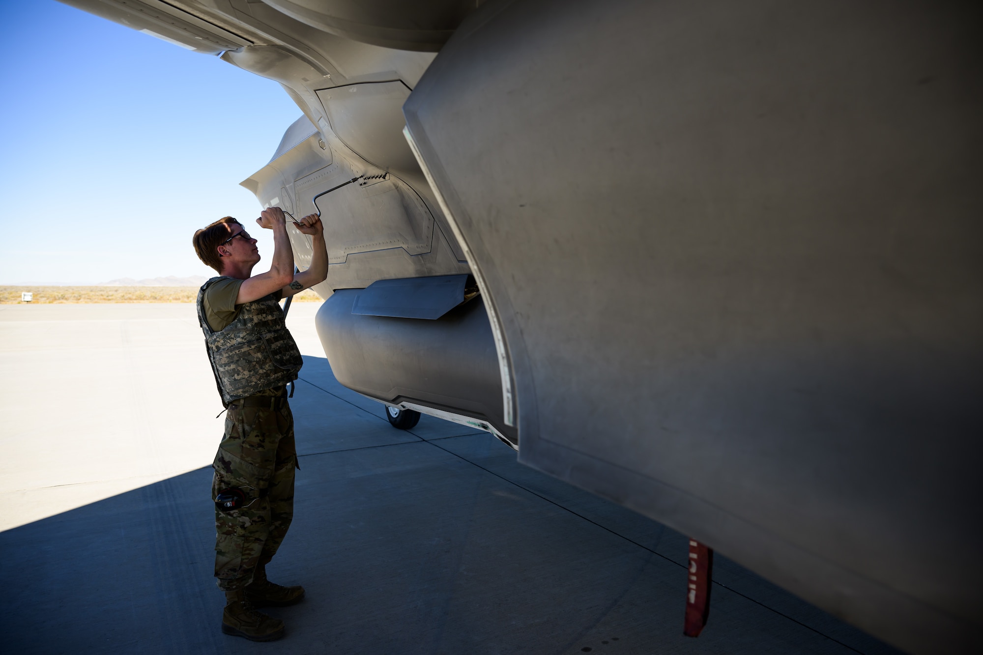 A photo of maintenance Airmen loading and fueling and preparing an F-35A Lightning II for launch.