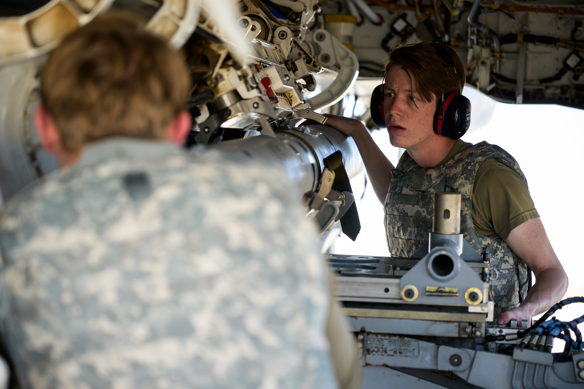 A photo of maintenance Airmen loading and fueling and preparing an F-35A Lightning II for launch.