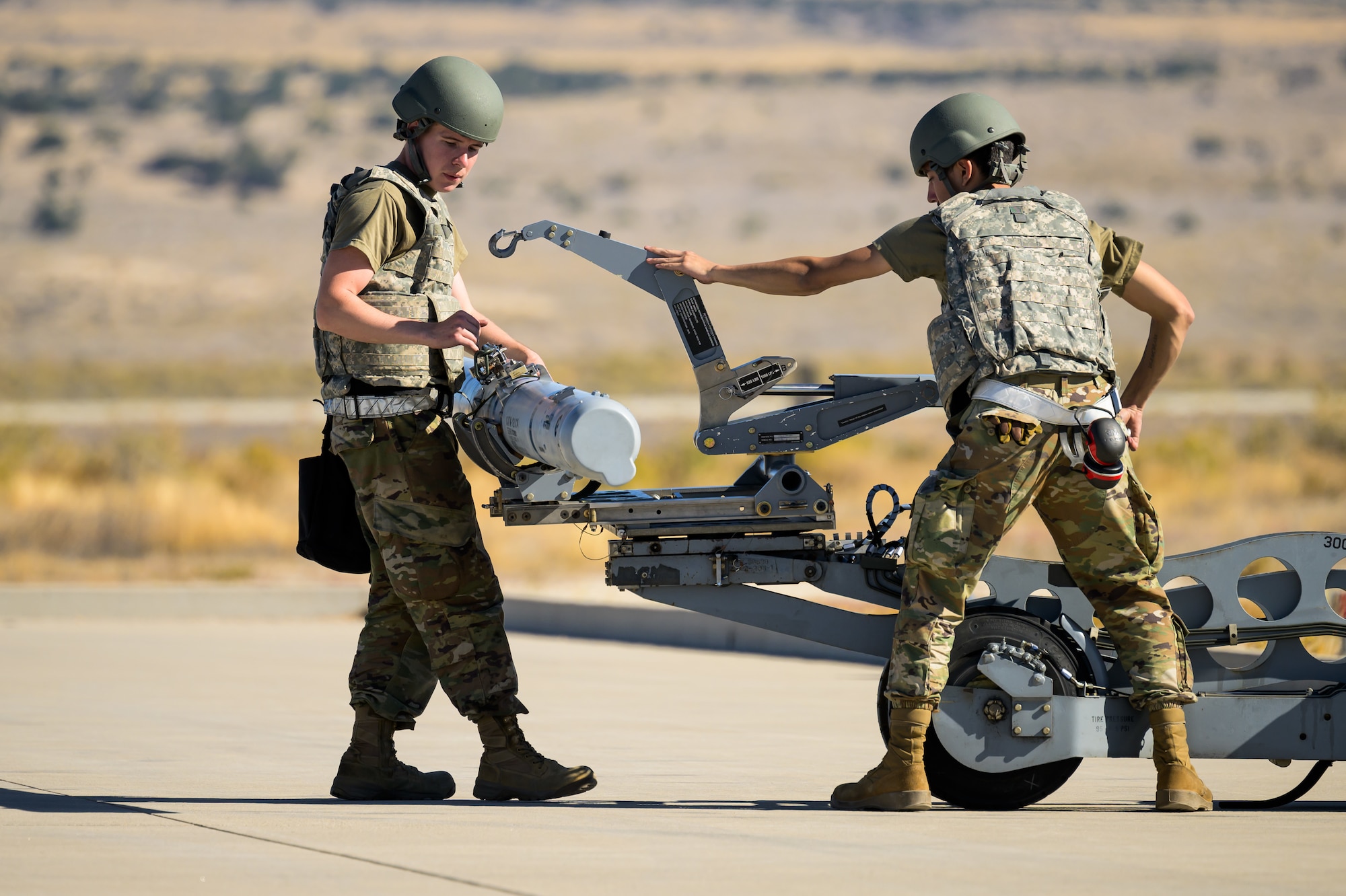 A photo of maintenance Airmen loading and fueling and preparing an F-35A Lightning II for launch.