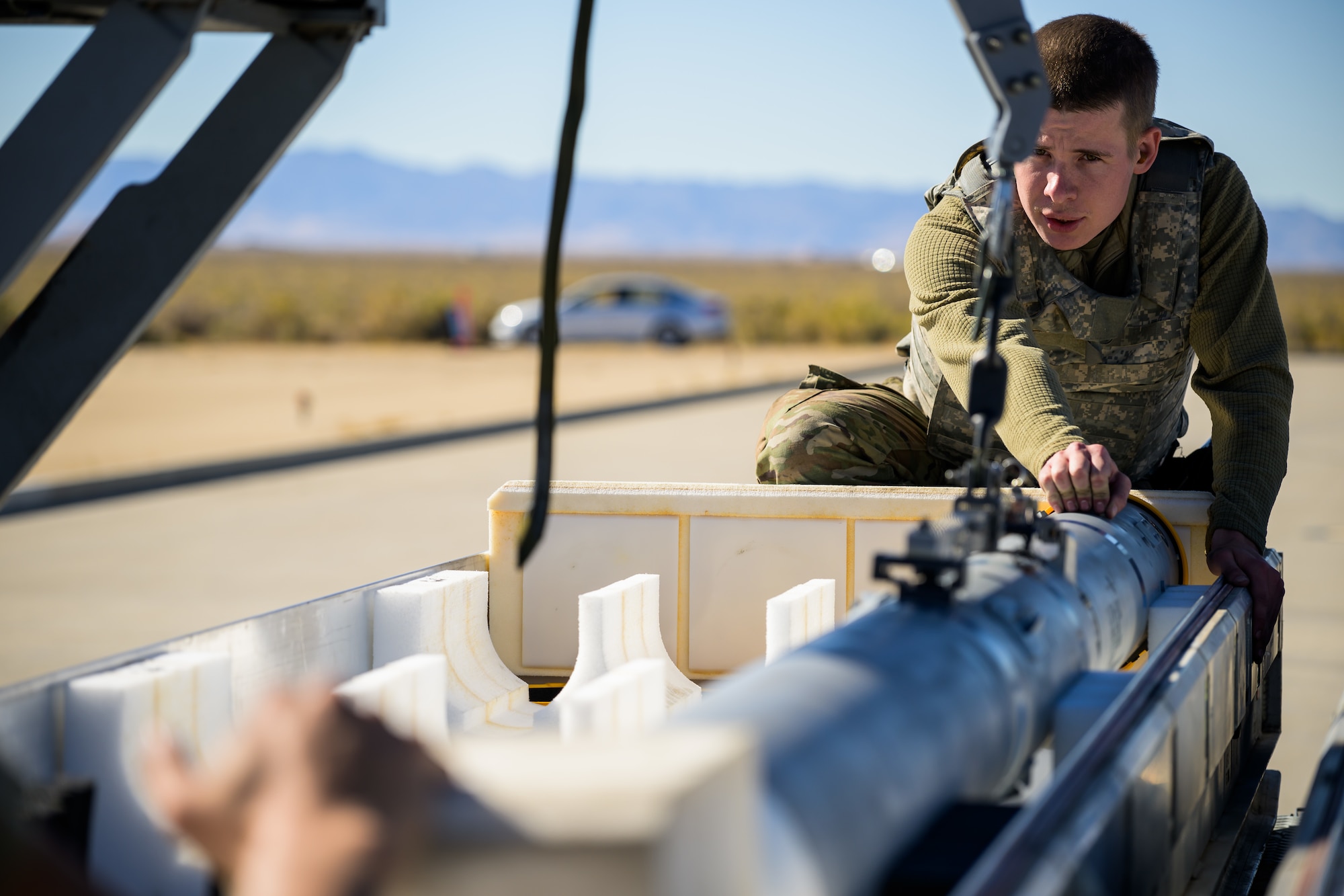 A photo of maintenance Airmen loading and fueling and preparing an F-35A Lightning II for launch.