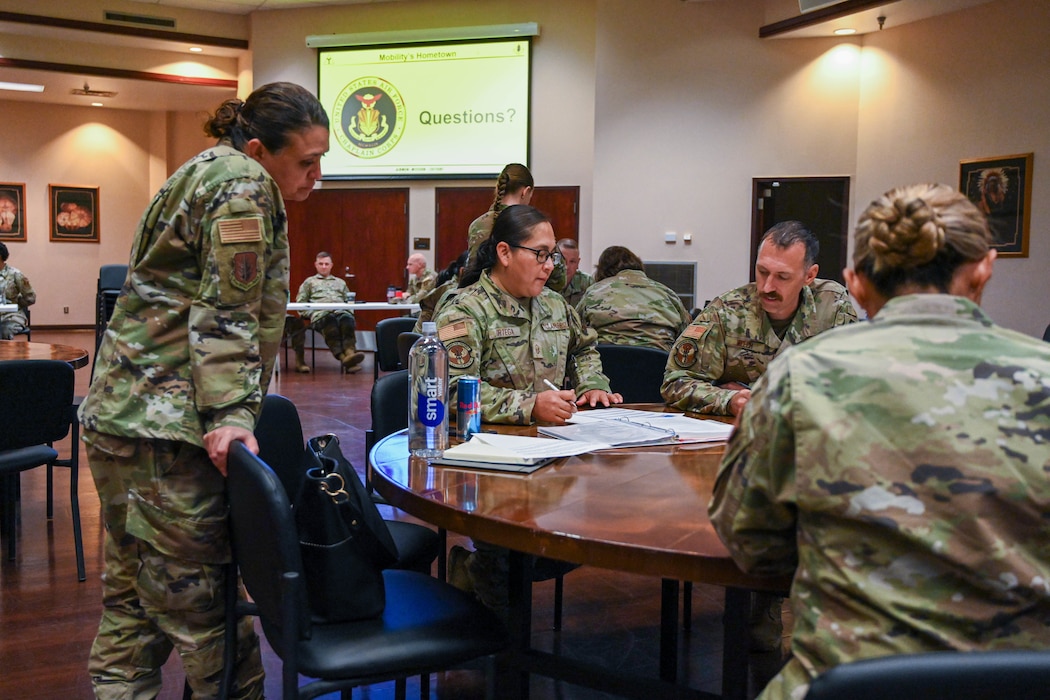 U.S. Air Force Col. Claudia Eid, 97th Medical Group commander, interacts with leaders from across the 97th Air Mobility Wing as they participate in a casualty response training at Altus Air Force Base, Oklahoma, Oct. 21, 2024. During the exercise, squadron and group command teams were given a scenario that they had to address, with the help and guidance of six support agencies. (U.S. Air Force photo by Senior Airman Miyah Gray)