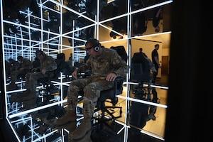 141st Air Refueling Wing Command Chief Master Sgt. Steven Webster tests the first ever Air National Guard owned MindGym, after its installation on October 3, 2024, at Fairchild Air Force Base, Washington. MindGym by Lumena is a sensory immersive cube that was created around neurofeedback, focused attention meditation, sensory deprivation and binaural beats. (U.S. Air Force Photo by Mass Communicator Tech. Sgt. Michael Brown)