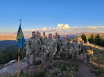 Soldiers of Headquarters and Headquarters Company, 117th Space Battalion, Colorado Army National Guard at the top of Shrine Mountain after conducting familiarization training with night-vision goggles, Sept. 7, 2024. This hike was part of a three-day training conducted in the White River National Forest, Colorado. (U.S. Army National Guard photo by Sgt. Ambrose Solis)
