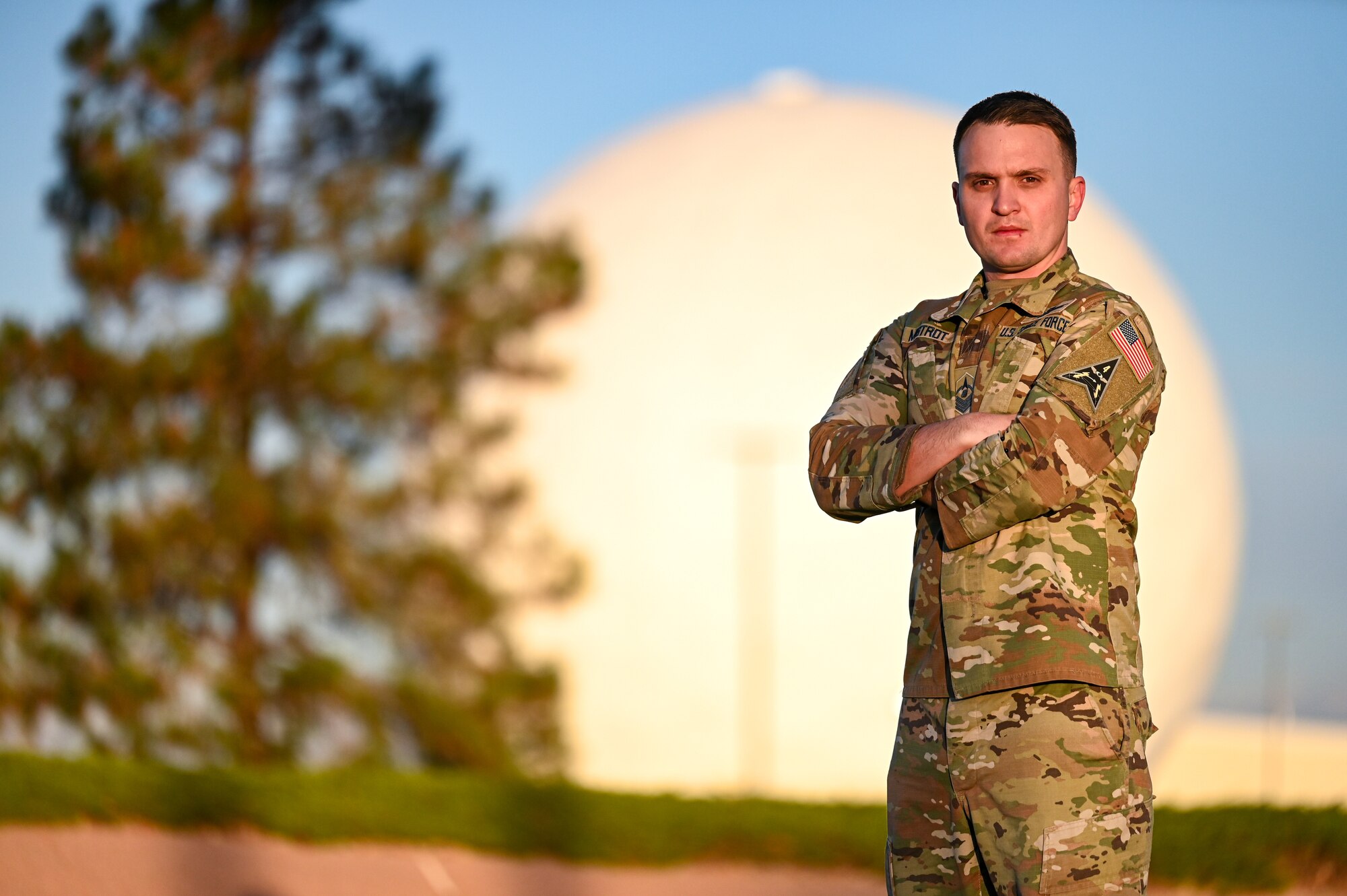 U.S. Space Force Master Sgt. Eric Mistrot, 2d Space Warning Squadron senior enlisted leader stands in front of one of the radomes on Buckley Space Force Base, Colorado, October 24, 2024. Mistrot played a key role in the implementation of Space Delta 4’s Guardian and Airman Development Program, an initiative teaching enlisted members to have a mission-command approach, from the junior level, to meet the demands of the service and formation. (U.S. Space Force photo by Tech. Sgt. Jordan Thompson)