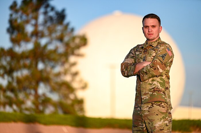 U.S. Space Force Master Sgt. Eric Mistrot, 2d Space Warning Squadron senior enlisted leader stands in front of one of the radomes on Buckley Space Force Base, Colorado, October 24, 2024. Mistrot played a key role in the implementation of Space Delta 4’s Guardian and Airman Development Program, an initiative teaching enlisted members to have a mission-command approach, from the junior level, to meet the demands of the service and formation. (U.S. Space Force photo by Tech. Sgt. Jordan Thompson)