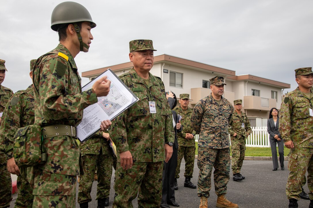 U.S. Marine Corps Col. Richard Rusnok, center right, the commanding officer of Marine Corps Air Station Iwakuni and a Pennsylvania native, and Japan Ground Self-Defense Force Lt. Gen. Hiroki Kobayashi, center left, the commanding general of the Middle Army, observe a training scenario during exercise Keen Sword 25 at MCAS Iwakuni, Japan, Oct. 27, 2024. Keen Sword is a biennial, joint and bilateral field-training exercise involving U.S. military and Japan Self-Defense Force personnel, designed to increase readiness and interoperability while strengthening the ironclad U.S.-Japan alliance. (U.S. Marine Corps photo by Sgt. Randall Whiteman) (This photo has been altered for security purposes by blurring out identification badges.)