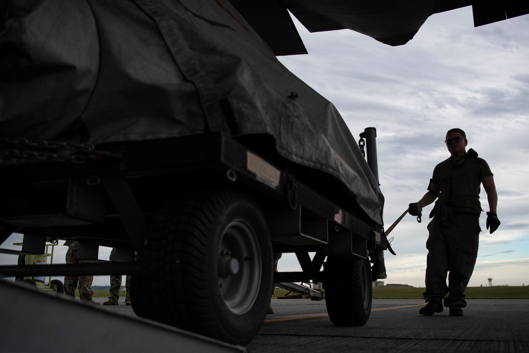U.S. Air Force Senior Airman Staff Sgt. Liam Moorehead, 730 Air Mobility Squadron air freight technician, loads an engine prop change cart onto a C-130J Super Hercules.