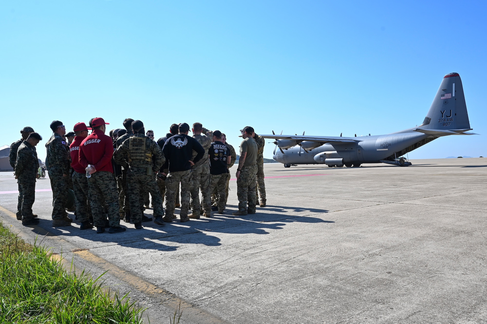 At Kunsan Air Base, Republic of Korea, on Oct. 24, 2024, U.S. Air Force Airmen assigned to the 36th Airlift Squadron, U.S. Army Special Forces Soldiers assigned to the 1st Special Forces Group (Airborne), and Republic of Korea Special Warfare Command Soldiers assigned to the 1st Special Forces Brigade, conduct a pre-mission brief for a high-altitude, high-opening proficiency jump in preparation for Freedom Flag 24-1.