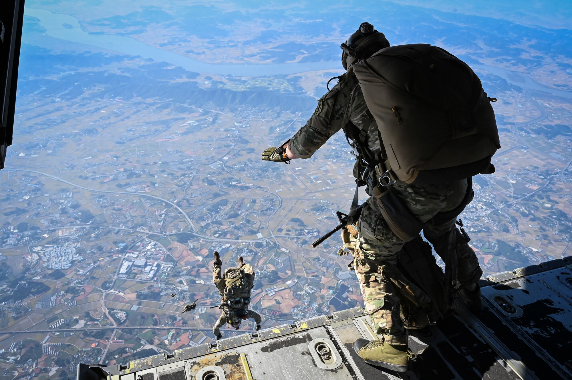 U.S. Army Special Forces Soldiers assigned to the 1st Special Forces Group (Airborne) jump from a C-130J Super Hercules assigned to the 36th Airlift Squadron, during a high-altitude, high-opening (HAHO) proficiency jump training event in preparation for Freedom Flag 24-1 at Kunsan Air Base, Republic of Korea.