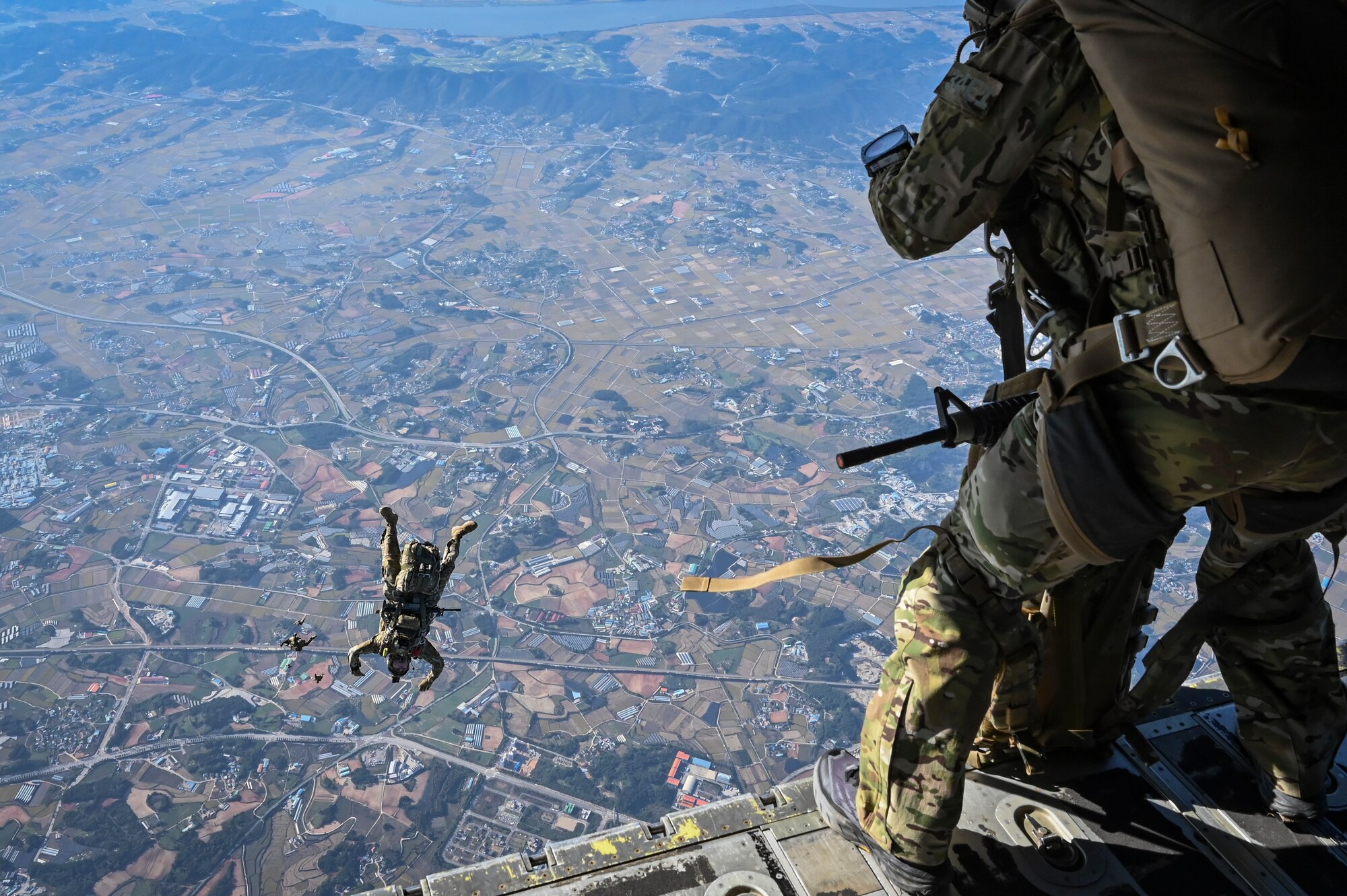 U.S. Army Special Forces Soldiers assigned to the 1st Special Forces Group (Airborne), jump from a C-130J Super Hercules assigned to the 36th Airlift Squadron, during a high-altitude, high-opening (HAHO) proficiency jump training event in preparation for Freedom Flag 24-1 at Kunsan Air Base, Republic of Korea.