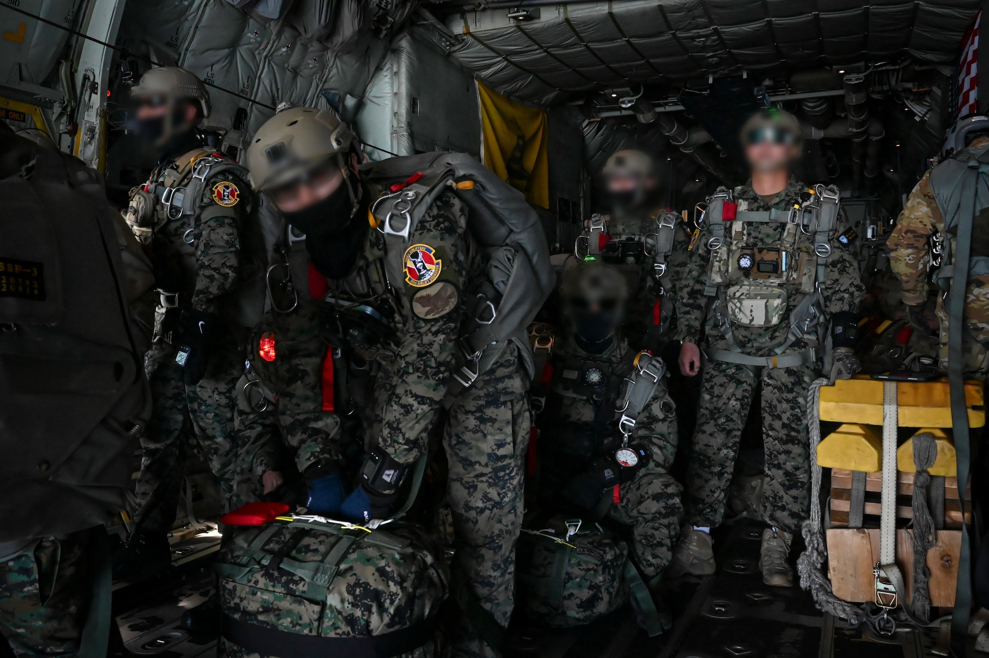 Republic of Korea Special Warfare Soldiers assigned to the 1st Special Forces Brigade prepare to jump from a C-130J Super Hercules assigned to the 36th Airlift Squadron during a high-altitude, high-opening proficiency jump training in preparation for Freedom Flag 24-1 at Kunsan Air Base, Republic of Korea.