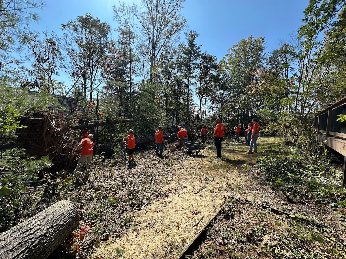 Volunteers with Samaritan’s Purse assist with tree removal after the devastation of Hurricane Helene in western North Carolina October 8, 2024. These volunteers are just a few of the thousands of people who have served through the organization in the western North Carolina relief effort. (Courtesy Photo)