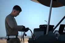 A 4th Special Operations Aircraft Maintenance Squadron crew chief, performs pre-flight checks on an AC-130J Ghostrider gunship at Hurlburt Field, Florida, Oct. 23, 2024.