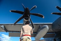 A U.S. Airman, assigned to the 4th Special Operations Aircraft Maintenance Squadron, conducts a pre-flight visual inspection of the props on an AC-130J Ghostrider gunship at Hurlburt Field, Florida, Oct. 23, 2024.