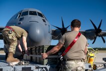 Weapons technicians assigned to the 4th Special Operations Aircraft Maintenance Squadron, load ammunition on an AC-130J Ghostrider gunship at Hurlburt Field, Florida, Oct. 23, 2024.