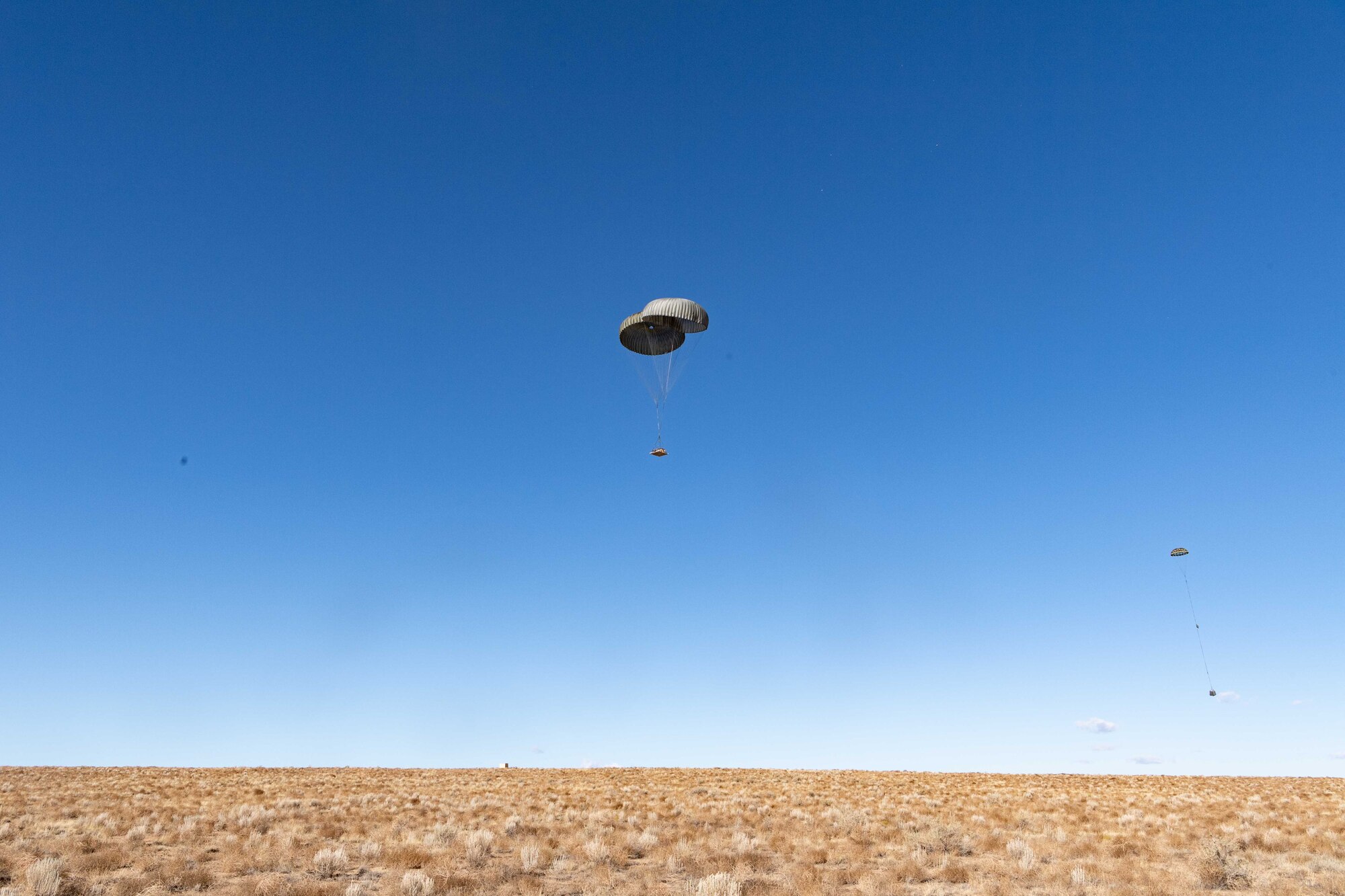The 58th Special Operation Wing conducted aerial deliveries at their new Howard Drop Zone near the Albuquerque airport, Double Eagle II, Oct. 30. The Howard Drop Zone is named after Master Sgt. Mona Howard who was the first female loadmaster for the MC-130 aircraft and spent many years as an instructor at the 58th SOW.
(U.S. Air Force photo by Allen Winston)
