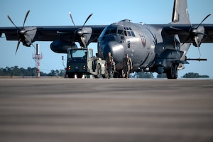 U.S. Airmen, assigned to the 4th Special Operations Aircraft Maintenance Squadron, tow an AC-130J Ghostrider gunship after a wash at Hurlburt Field, Florida, Oct. 23, 2024.