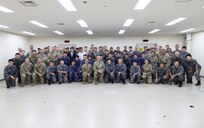 Military members from U.S. and Japan pose for a photo