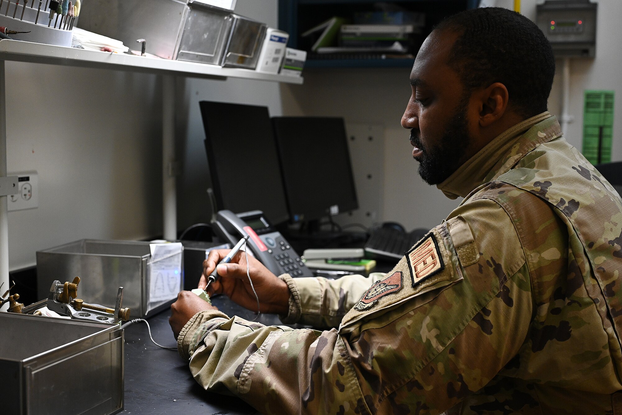 U.S. Air Force Staff Sgt. Jawanza Mitchell, 8th Operational Medical Readiness Squadron dental laboratory technician, designs restoration for a tooth.