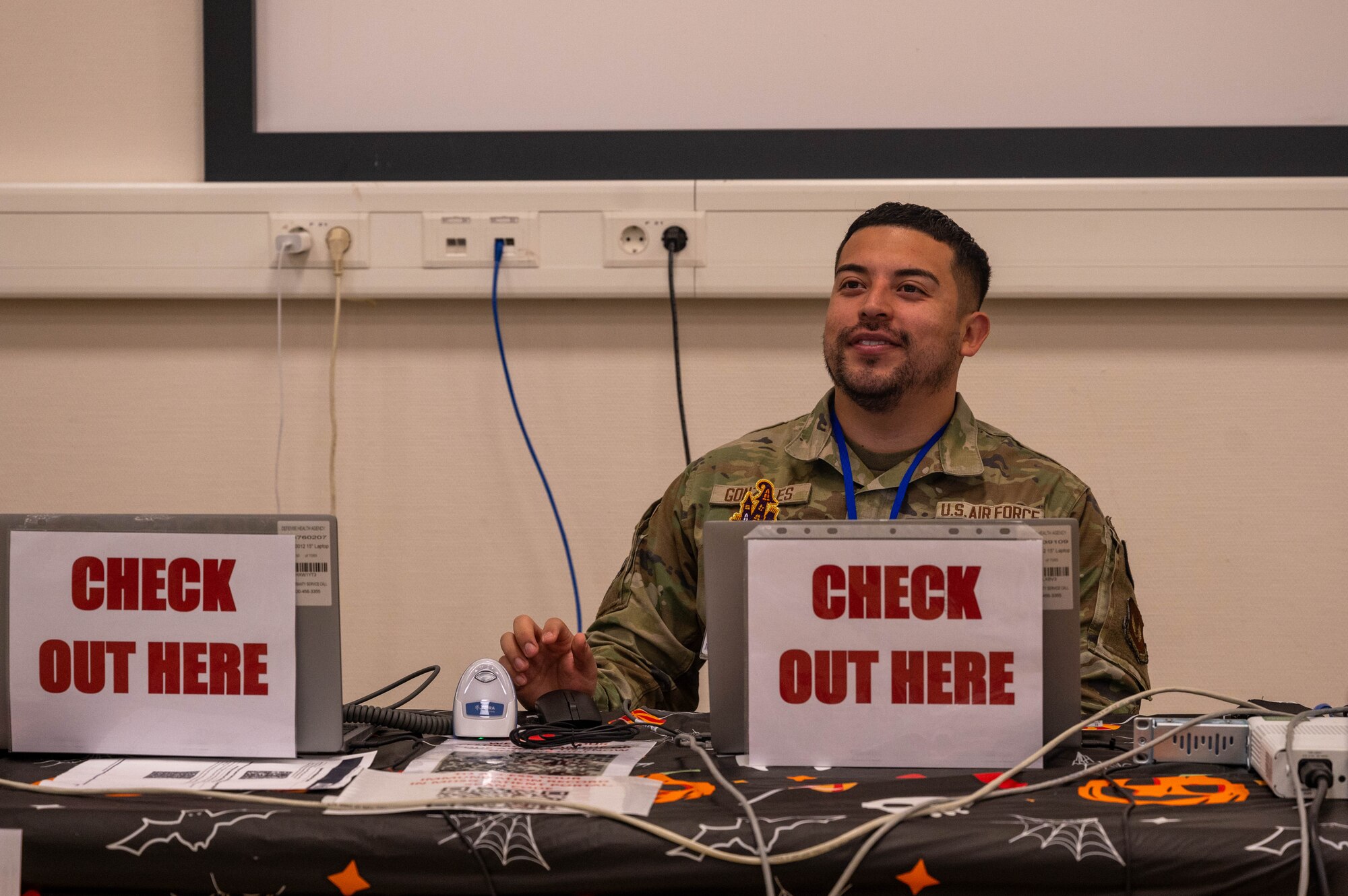 airmen assists patients with flu shots