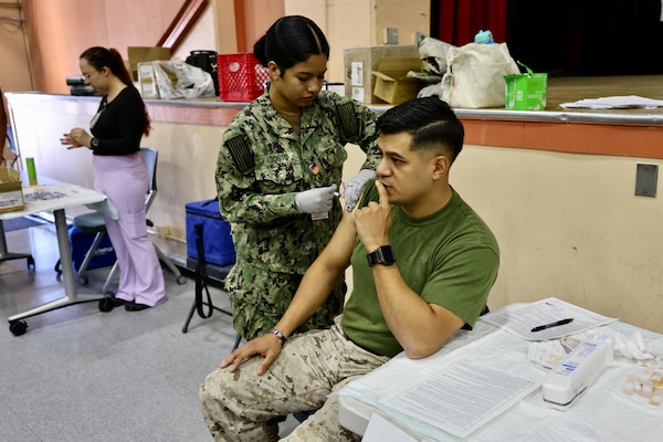 Sailors and hospital staff from Navy Medicine Readiness and Training Command (NMRTC) Twentynine Palms conduct a Shot Exercise (SHOTEX) session from Oct. 15–28, providing influenza vaccinations to personnel across various non-deployable units at the Marine Corps Air Ground Combat Center (MCAGCC). This particular session of a wider SHOTEX primarily focused on supporting the Marine Corps Communications-Electronics School (MCCES), with vaccinations also being administered to the Marine Corps Logistics Operations Group (MCLOG), Tactical Training Exercise Control Group (TTECG), Marine Air Ground Task Force Training Command (MAGTFTC), Headquarters Battalion, and other units U.S. Navy photo by Christopher C. Jones, NHTP/NMRTC Twentynine Palms public affairs officer).