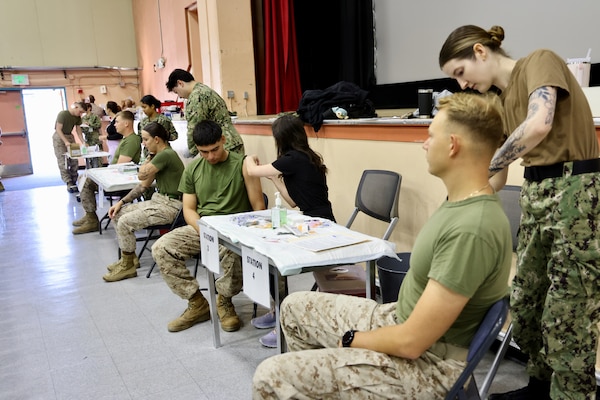 Sailors and hospital staff from Navy Medicine Readiness and Training Command (NMRTC) Twentynine Palms conduct a Shot Exercise (SHOTEX) session from Oct. 15–28, providing influenza vaccinations to personnel across various non-deployable units at the Marine Corps Air Ground Combat Center (MCAGCC). This particular session of a wider SHOTEX primarily focused on supporting the Marine Corps Communications-Electronics School (MCCES), with vaccinations also being administered to the Marine Corps Logistics Operations Group (MCLOG), Tactical Training Exercise Control Group (TTECG), Marine Air Ground Task Force Training Command (MAGTFTC), Headquarters Battalion, and other units U.S. Navy photo by Christopher C. Jones, NHTP/NMRTC Twentynine Palms public affairs officer).