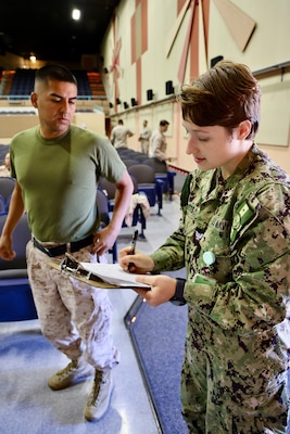 Sailors and hospital staff from Navy Medicine Readiness and Training Command (NMRTC) Twentynine Palms conduct a Shot Exercise (SHOTEX) session from Oct. 15–28, providing influenza vaccinations to personnel across various non-deployable units at the Marine Corps Air Ground Combat Center (MCAGCC). This particular session of a wider SHOTEX primarily focused on supporting the Marine Corps Communications-Electronics School (MCCES), with vaccinations also being administered to the Marine Corps Logistics Operations Group (MCLOG), Tactical Training Exercise Control Group (TTECG), Marine Air Ground Task Force Training Command (MAGTFTC), Headquarters Battalion, and other units U.S. Navy photo by Christopher C. Jones, NHTP/NMRTC Twentynine Palms public affairs officer).