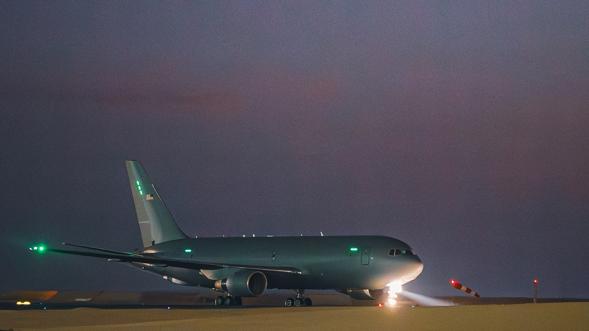 A KC-46 Pegasus sits on a flightline.