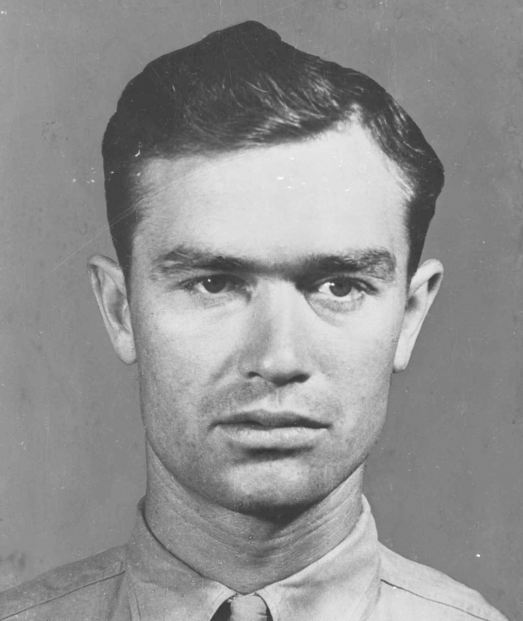 A Marine poses for a shoulder-length photo.