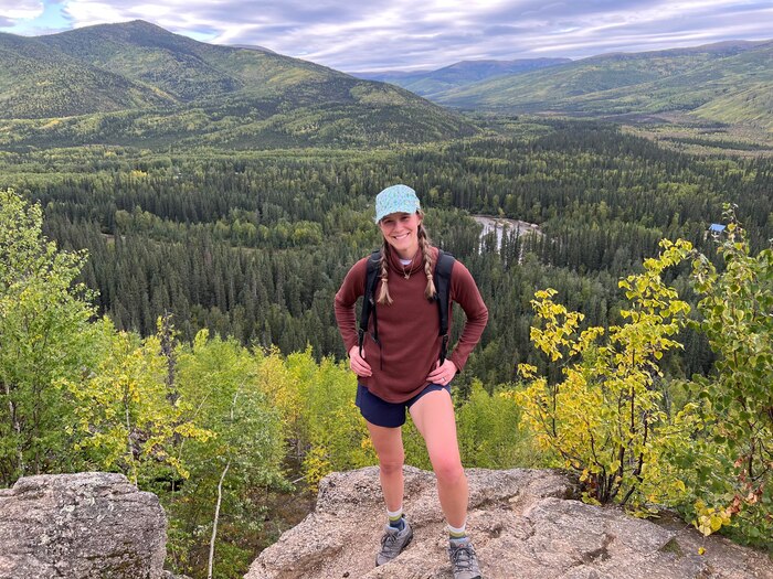 Image of 1st Lt. Bridget Maloy on a mountaintop.