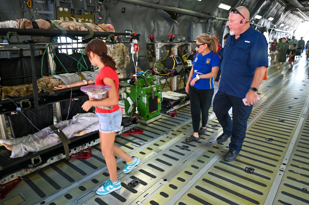 Airshow visitors examine equipment the 433rd Aeromedical Evacuation Squadron uses to transport patients and train during the Wings Over Houston Airshow at Ellington Airport, Houston, Texas Oct. 26, 2024.