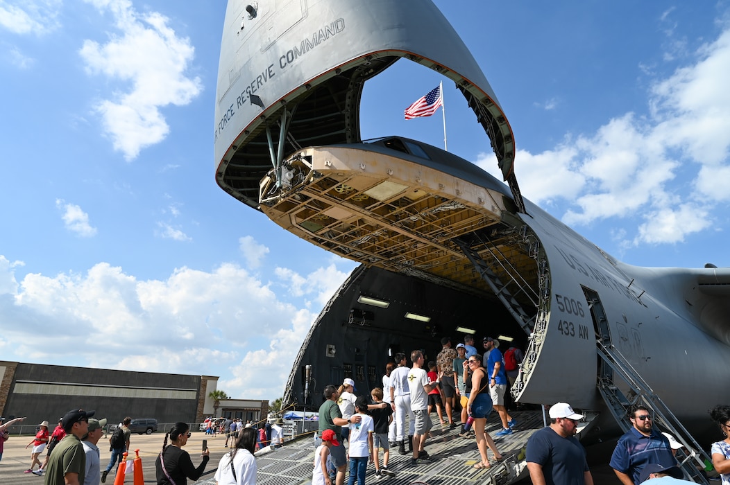 Guests at the Wings Over Houston Airshow take advantage of a rare opportunity to go inside and photograph a 433rd Airlift Wing C-5M Super Galaxy at Ellington Airport, Houston, Texas Oct. 26, 2024.