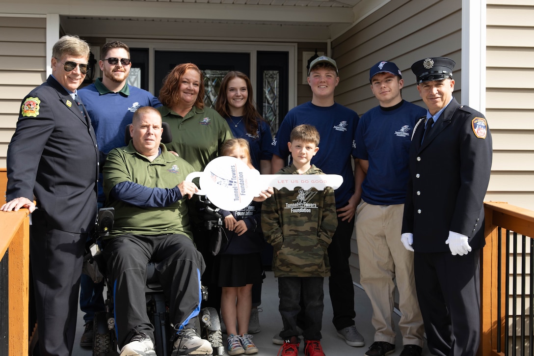 Kentucky National Guardsman, Maj. John Rock and his family cut the ribbon on their new ADA compliant home, Oct. 28, courtesy of the Tunnel to Towers Foundation, a non-profit organization founded following the terrorist attacks of September 11, 2001.