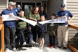 Kentucky National Guardsman, Maj. John Rock and his family cut the ribbon on their new ADA compliant home, Oct. 28, courtesy of the Tunnel to Towers Foundation, a non-profit organization founded following the terrorist attacks of September 11, 2001. (U.S. Army National Guard photo by Milt Spalding)