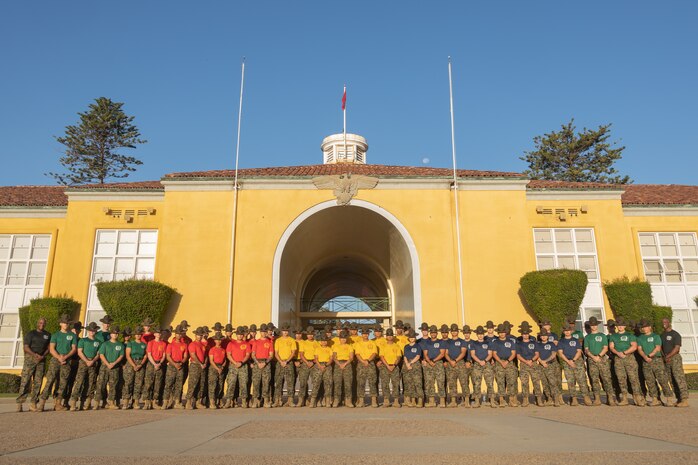 U.S. Marine Corps drill instructors, Recruit Training Regiment, Marine Corps Recruit Depot San Diego, pose for a photo prior to the 2024 Marine Corps Recruit Depot San Diego Boot Camp Challenge at MCRD San Diego, California, Oct. 19, 2024. For the past 23 years, MCRD San Diego has hosted the bootcamp challenge, a three-mile obstacle course race guided by 60 drill instructors that highlights the physical and mental demands of bootcamp. The event fosters comradery and community engagement through interaction with MCRD personnel. (U.S. Marine Corps photo by Lance Cpl. Janell B. Alvarez)