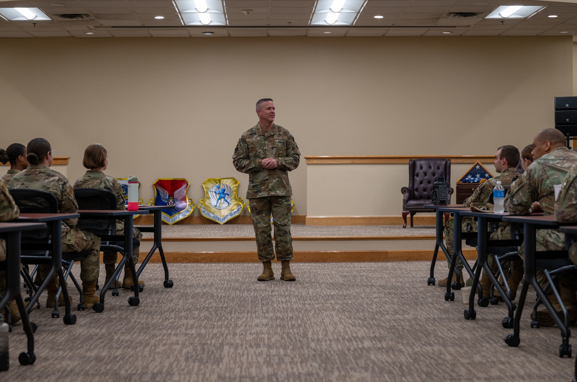 U.S. Air Force Chief Master Sgt. Dennis Fuselier, U.S. Air Force Expeditionary Center command chief, speaks with Airmen Leadership School students during a visit to Joint Base Charleston, South Carolina, Oct. 29, 2024. During their visit, Snelson and Fuselier gained insight into JB Charleston’s vital contributions to global mobility, rapid deployment, and joint operations. (U.S. Air Force photo by Senior Airman Christian Silvera)