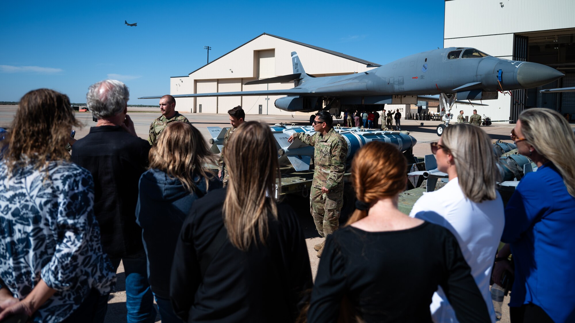 Airmen from the 7th Munitions Squadron explain the munition capabilities of the B-1B Lancer to Abilene medical personnel at Dyess Air Force Base, Texas, Oct. 25, 2024. The 7th Medical Group met with local medical personnel to explain the Dyess mission and opened a discussion on the continuing partnership between them. (U.S. Air Force photo by Airman 1st Class Jade M. Caldwell)