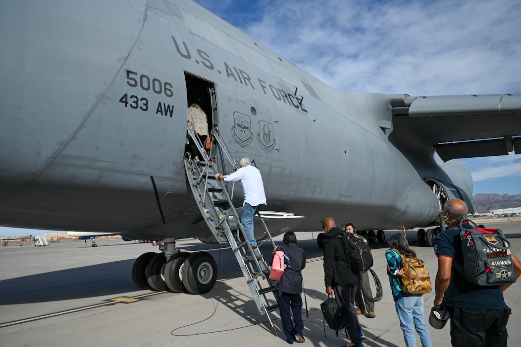 16 Greater San Antonio area civic leaders board a 433rd Airlift Wing C-5M Super galaxy after learning about the 926th Wing missions on a civic leader tour at Nellis Air Force Base, Nevada, Oct. 23, 2024.