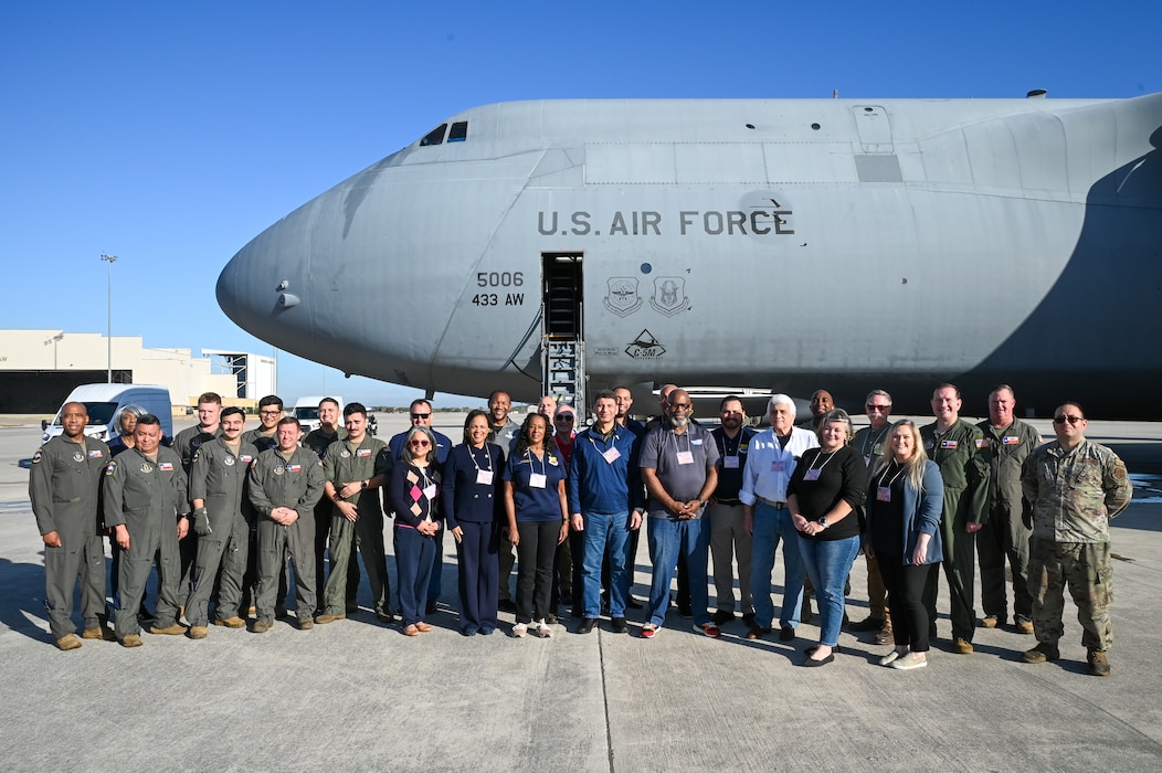 Greater San Antonio area civic leaders pose for a group photo with 433rd Airlift Wing Reserve Citizen Airmen before a civic leader tour mission at Joint Base San Antonio-Lackland, Texas, Oct. 23, 2024.