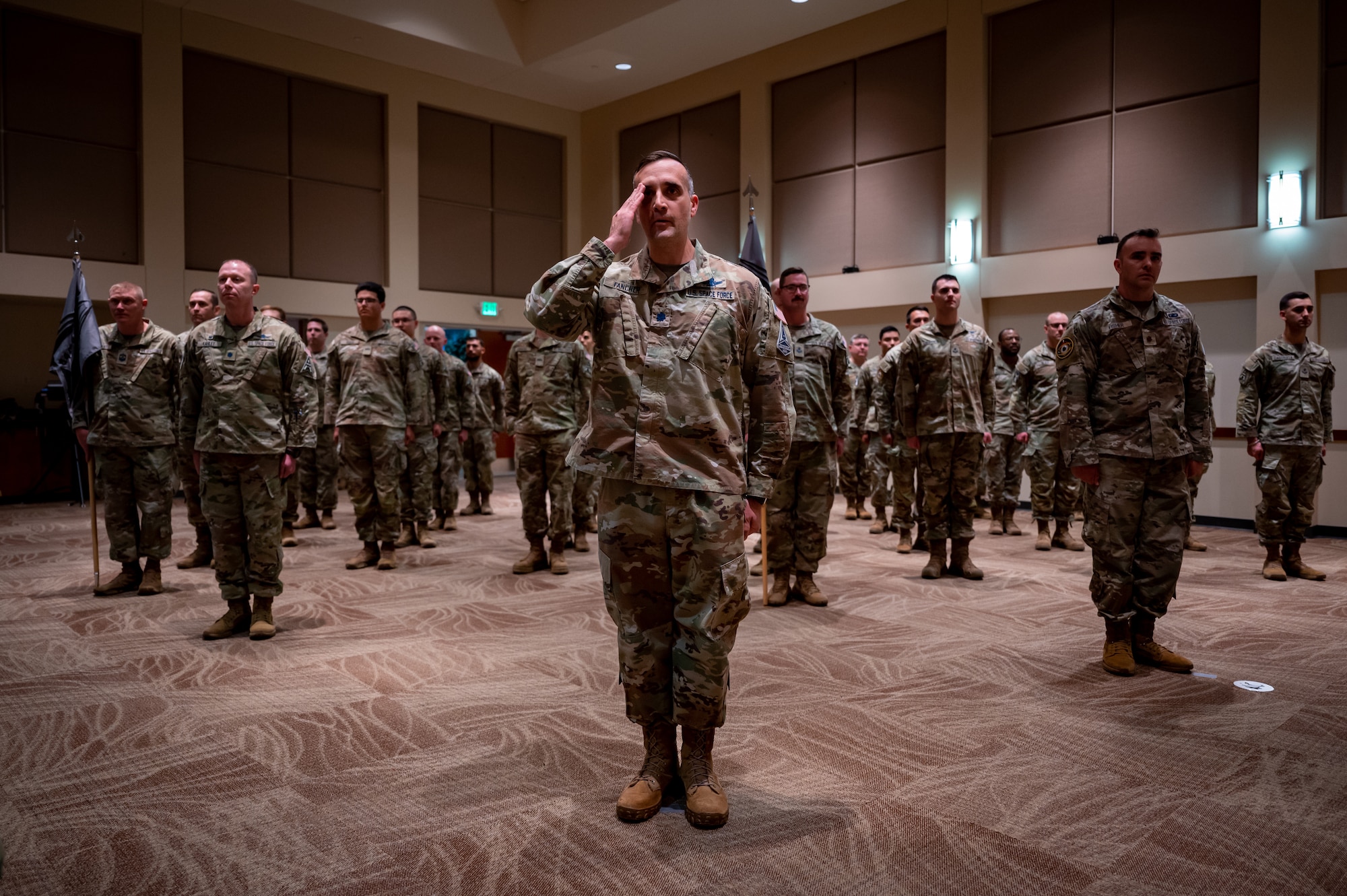 Servicemembers render a first salute to U.S. Space Force Col. Ernest “Bobby” Schmitt, Space Delta 4 commander, during the MD 4 redesignation ceremony, Oct. 30, 2024. Mission Deltas oversee all aspects of mission area functions – people, training, equipment and combat sustainment.