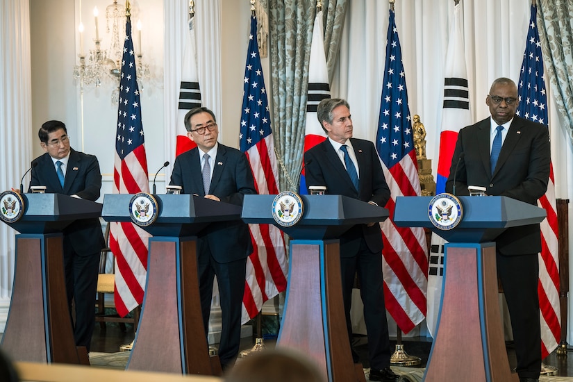 Secretary of Defense Lloyd J. Austin III, Secretary of State Antony J. Blinken and their South Korean counterparts stand at four lecterns.