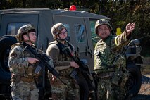 Airmen receive directions from a JGSDF member