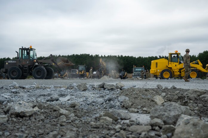 U.S. Airmen assigned to the 35th Civil Engineer Squadron, and Japanese Armed Forces muster for a safety brief prior to a bilateral rapid airfield damage repair exercise as part of Keen Sword 25 at Draughon Range near Misawa Air Base, Japan, Oct. 30, 2024.