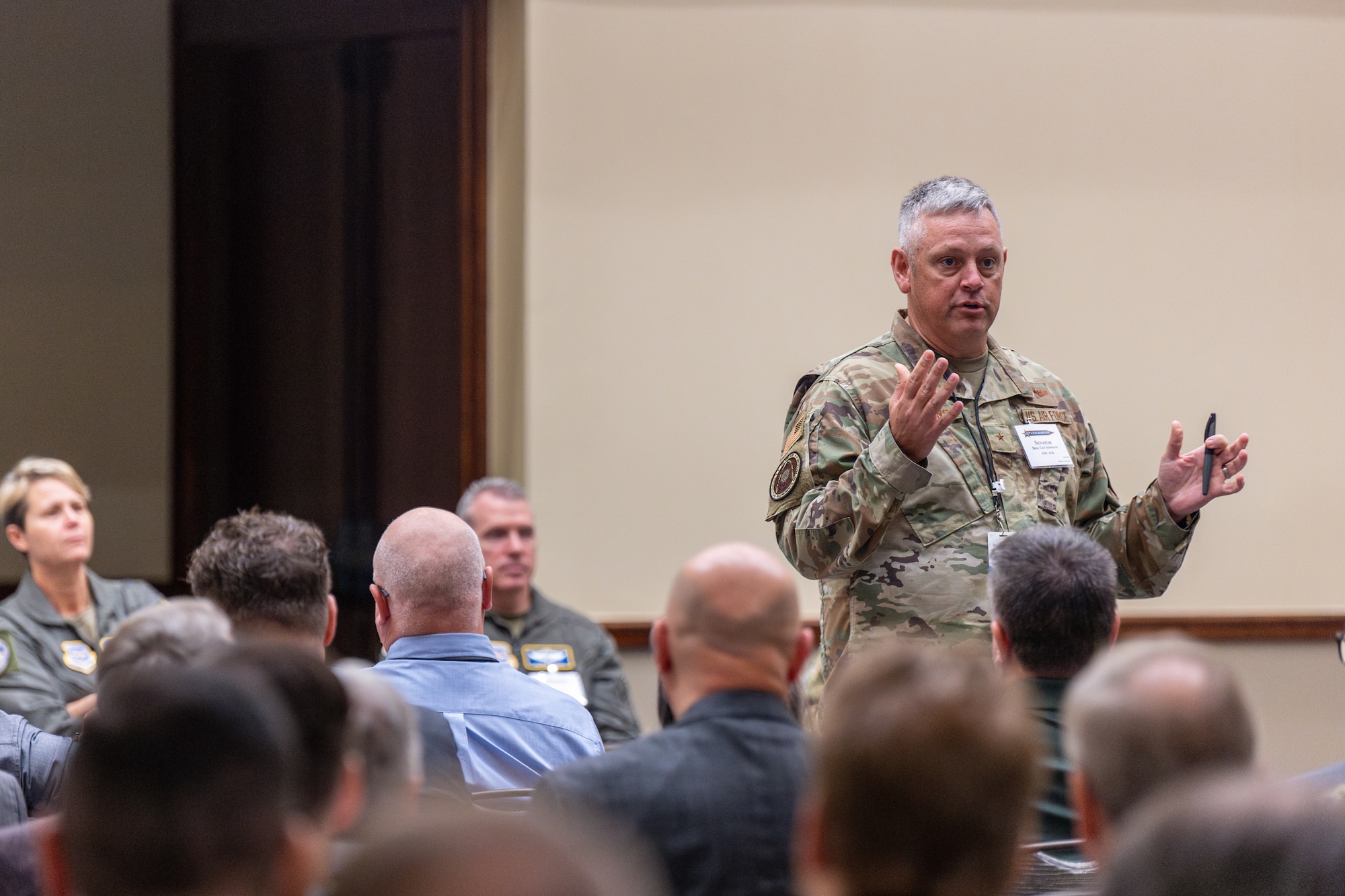 U.S. Air Force Brig. Gen. Corey Simmons, Air Mobility Command director of strategy, plans, requirements and programs, talks on a panel with other AMC leaders during the Fall Industry Preview Oct. 31, 2024, in Grapevine, Texas. Fall Industry Preview provides a platform for industry partners to present AMC leaders potential advancements and solutions, strengthening partnerships to prevail in an era of Great Power Competition. (U.S. Air Force photo by Chris Bishop)