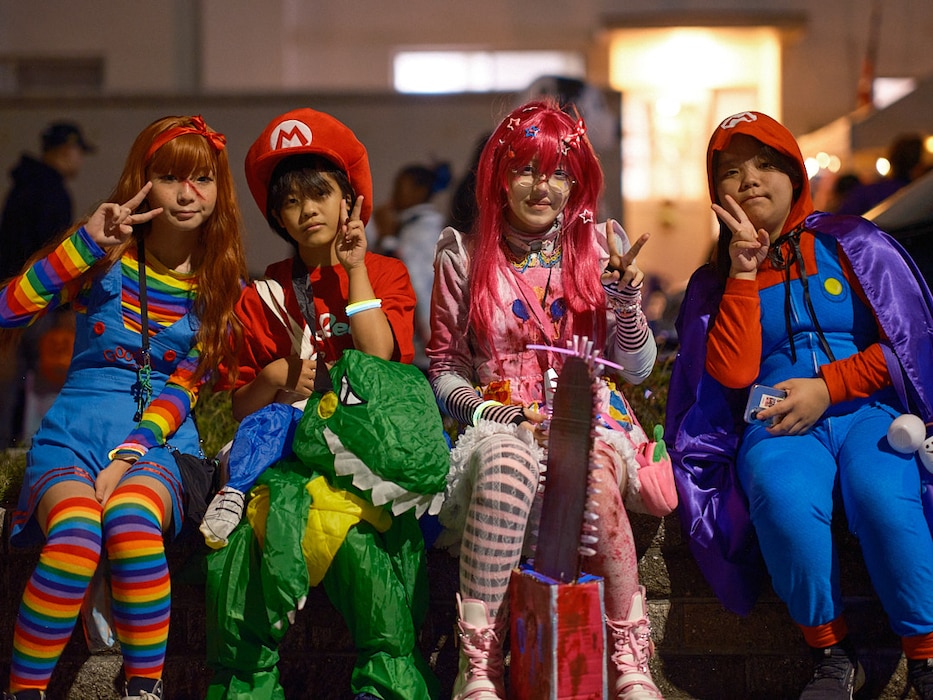 A group of children take a break from trick-or-treating October 31, 2024 on the installation's main base.