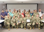 Nurses from Tripler Army Medical Center pose with an award and a certificate commemorating the hospital's designation as a Pathway to Excellence organization on Aug. 27, 2024. (Defense Health Agency photo by Khinna Kaminske)