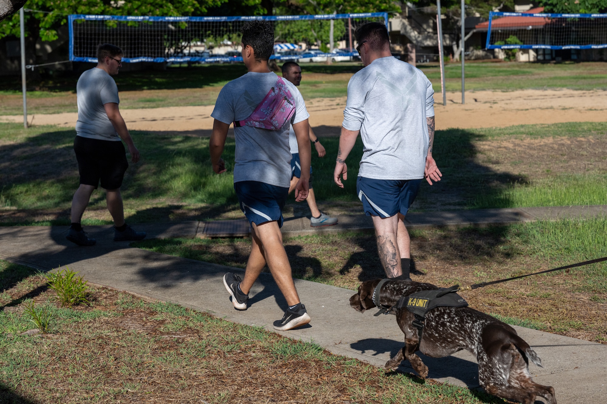 TSA working dog pursues suspect with simulated contraband during training.