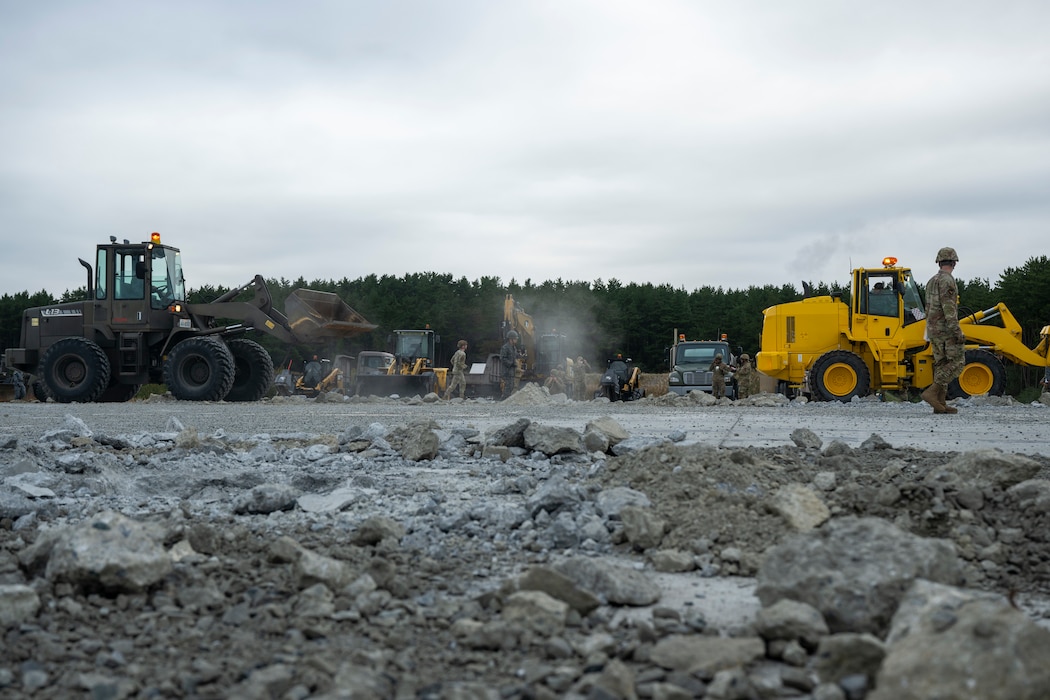 U.S. Airmen assigned to the 35th Civil Engineer Squadron, and Japanese Armed Forces muster for a safety brief prior to a bilateral rapid airfield damage repair exercise as part of Keen Sword 25 at Draughon Range near Misawa Air Base, Japan, Oct. 30, 2024.